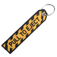 PULL TO EJECT BLACK AND GOLD KEYCHAIN